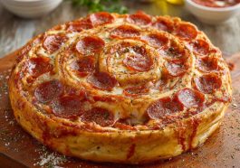 “A golden-brown jumbo pepperoni-stuffed pizza spiral sliced into rounds, oozing with melted cheese and served on a platter.”