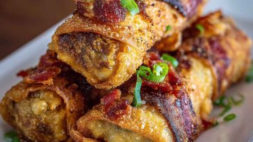 “Crispy golden voodoo egg rolls filled with spicy chicken, peppers, and cheese, served with dipping sauce.”