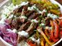 “A colorful steak fajita bowl with grilled steak strips, sautéed peppers, onions, avocado, and cauliflower rice.”