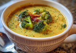 “A bowl of warming Italian broccoli soup with tender broccoli florets, garlic, olive oil, and Parmesan garnish.”