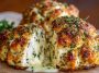 "Golden parmesan cloud chicken bombs baked to perfection, stuffed with cheesy chicken filling and topped with fresh herbs."