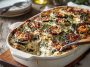 Ricotta eggplant casserole baked golden brown, layered with roasted eggplant slices, creamy ricotta cheese, marinara sauce, and topped with melted mozzarella and fresh basil.