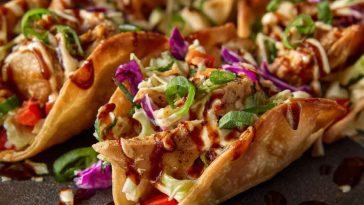 Applebee’s chicken wonton tacos with grilled chicken, slaw, and sauce in crispy wonton shells.