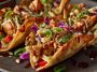 Applebee’s chicken wonton tacos with grilled chicken, slaw, and sauce in crispy wonton shells.