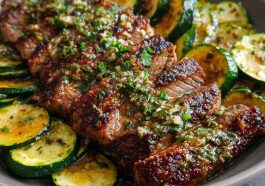 Effortless garlic butter steak and zucchini delight served in a skillet with juicy seared steak bites, sautéed zucchini, and a rich garlic butter sauce, garnished with fresh parsley.