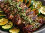 Effortless garlic butter steak and zucchini delight served in a skillet with juicy seared steak bites, sautéed zucchini, and a rich garlic butter sauce, garnished with fresh parsley.