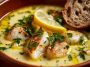Homemade lemon fish soup served in a rustic bowl, made with tender white fish, fresh vegetables, herbs, and a zesty lemon broth, garnished with parsley.