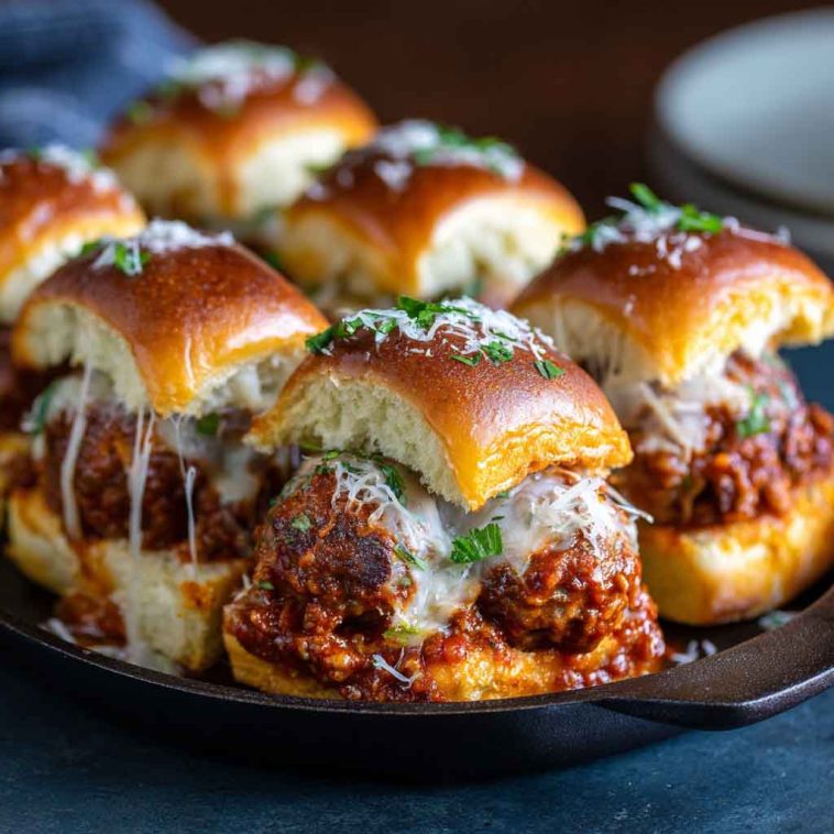 Cheesy pull-apart meatball sliders baked on soft Hawaiian rolls with marinara and melted mozzarella