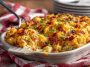 Golden baked Dolly Parton’s 5-ingredient casserole served in a dish with melted cheese on top.