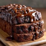 Hot Fudge Brownie Bread with rich chocolate swirls, gooey fudge chunks, and a soft, moist texture served on a plate.