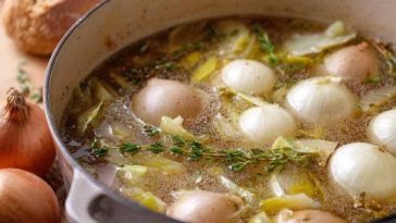 Homemade onion boil recipe with tender boiled onions, seasoned broth, and fresh herbs served in a rustic pot.