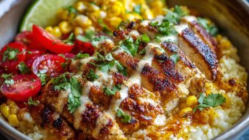 Quick and delicious street corn chicken bowls served with grilled chicken, roasted corn, creamy sauce, rice, and fresh toppings like cilantro and lime.