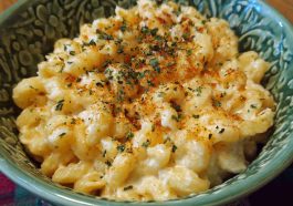 Simple Boursin mac and cheese served in a bowl with creamy sauce made from Boursin cheese, topped with fresh herbs and a golden breadcrumb crust.