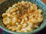 Simple Boursin mac and cheese served in a bowl with creamy sauce made from Boursin cheese, topped with fresh herbs and a golden breadcrumb crust.