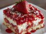 Strawberry earthquake cake with gooey cream cheese swirls and fresh strawberries on top.