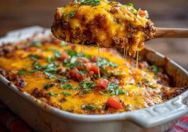 Cheesy crazy good casserole baked golden brown with layers of pasta, meat, and melted cheese served in a dish.