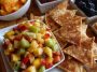 Fresh fruit salsa with strawberries, kiwi, and pineapple served with crispy cinnamon sugar tortilla chips on the side.