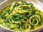 Creamy zucchini sauce made with fresh zucchini, garlic, olive oil, and herbs, served over pasta in a white bowl.