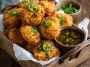 Crispy golden Jalapeno Corn Nuggets served with dipping sauce on a platter.