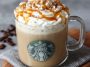 Homemade caramel brulée latte topped with whipped cream and caramel drizzle in a Starbucks-style mug