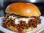 Juicy ground beef Sloppy Joes topped with melted cheese, peppers, and onions, inspired by Gordon Ramsay’s Philly Cheesesteak twist.