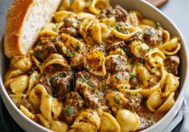 One-Pot Creamy Beef and Shells in Under 30 Minutes with tender pasta shells, ground beef, and creamy sauce, garnished with parsley.