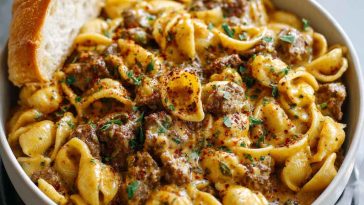 One-Pot Creamy Beef and Shells in Under 30 Minutes with tender pasta shells, ground beef, and creamy sauce, garnished with parsley.