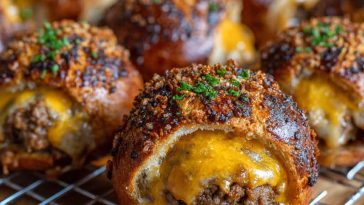 Cheeseburger pretzel bombs with golden pretzel crust stuffed with seasoned beef and melted cheese, served with dipping sauces.