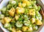 Pineapple cucumber salad with fresh herbs in a bowl