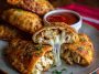 Golden crispy chicken Alfredo calzone filled with creamy Alfredo sauce, tender chicken, and melted mozzarella cheese.