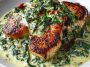 Boneless Pork Chops in Creamy Garlic Spinach Sauce served on a plate with golden-brown pork and creamy spinach sauce.