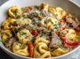 Creamy crock pot cheesesteak tortellini with tender beef, melted cheese, and tender pasta in a savory sauce.