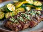 Juicy garlic butter steak bites with sautéed zucchini cooked in a skillet, coated in a rich buttery garlic sauce for a quick and flavorful dinner.