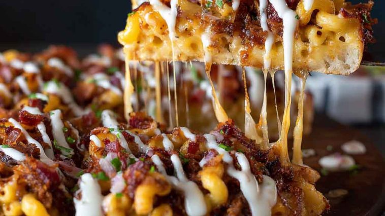 “A BBQ pulled pork pizza topped with creamy mac ’n’ cheese, crispy bacon, and melted cheese on a golden crust.”