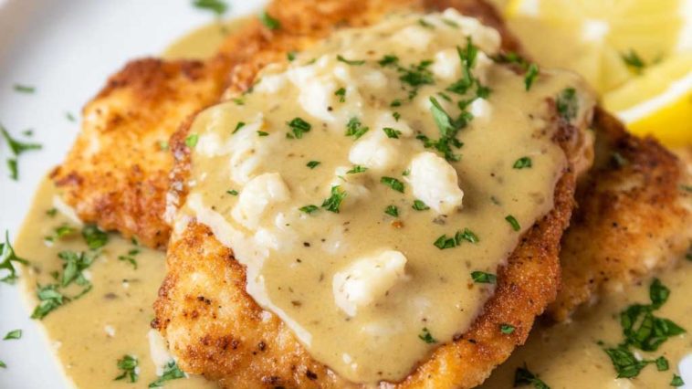 Golden chicken francese cutlets coated in a light egg batter, pan‑fried, and served with lemon butter sauce.