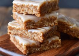 Crispy Homemade Maple Bars with Sweet Maple Glaze, golden-brown bars drizzled with sweet maple icing, served on a plate.