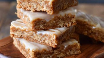 Crispy Homemade Maple Bars with Sweet Maple Glaze, golden-brown bars drizzled with sweet maple icing, served on a plate.