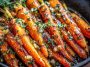 Honey garlic butter roasted carrots baked until caramelized, garnished with parsley, and served on a rustic platter.