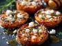 Roasted Sweet Potato Rounds with Honey & Feta Bliss drizzled with honey, sprinkled with crumbled feta, and garnished with fresh herbs.