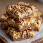 Golden cake mix toffee bars with chocolate drizzle and crunchy toffee pieces on a serving tray