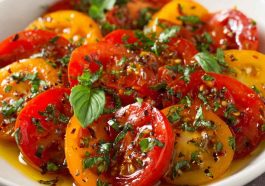 Marinated tomatoes with herbs, garlic, and olive oil in a fresh, flavorful dressing.