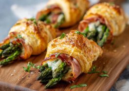 Flaky puff pastry bundles wrapped with prosciutto and fresh asparagus, baked until golden and crispy.