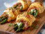 Flaky puff pastry bundles wrapped with prosciutto and fresh asparagus, baked until golden and crispy.