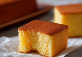 Bitten slice of Castella cake showing fluffy texture