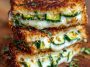 Crispy grilled cheese sandwich with zucchini slices and garlic butter, melted cheese inside.