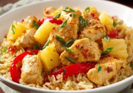 Pineapple chicken and rice with tender chicken, sweet pineapple chunks, and fluffy rice in a savory sauce.