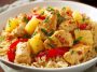 Pineapple chicken and rice with tender chicken, sweet pineapple chunks, and fluffy rice in a savory sauce.