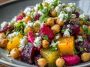 A vibrant bowl of chickpea, beet, and feta salad with roasted beets, creamy feta crumbles, chickpeas, fresh herbs, and a light vinaigrette.