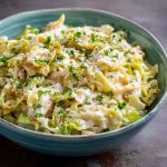Creamy garlic Alfredo sauce coating tender sautéed cabbage in a rich and comforting dish.