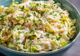 Creamy garlic Alfredo sauce coating tender sautéed cabbage in a rich and comforting dish.